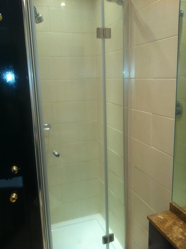 Frameless glass shower enclosure with chrome fittings in Beaconsfield