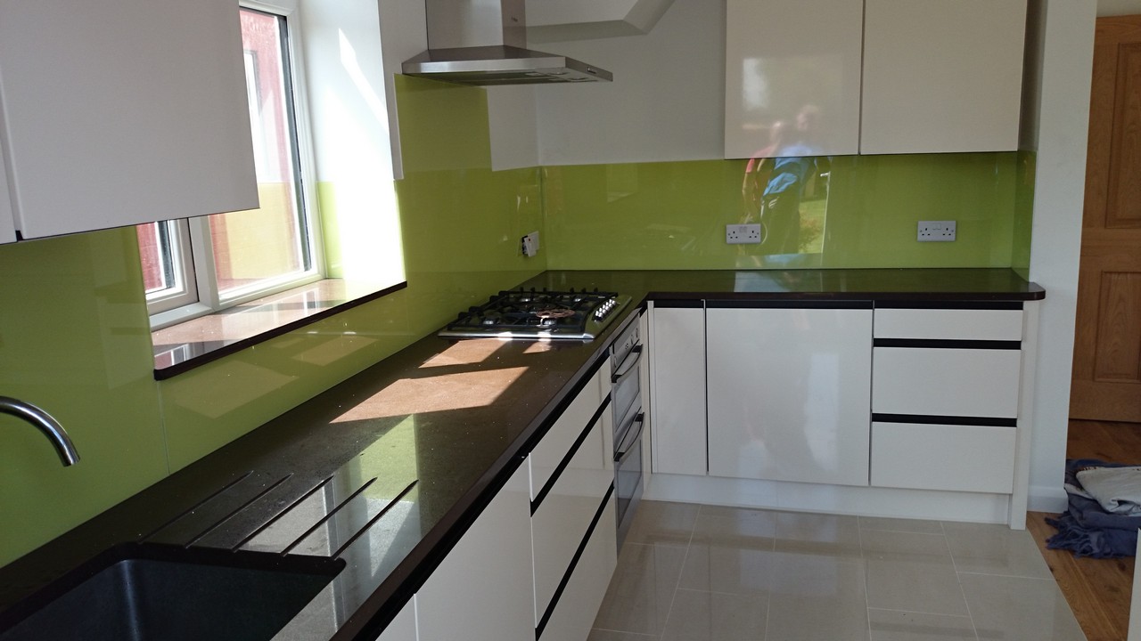Lime green glass kitchen splashback installed by Beaconsfield glaziers